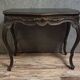 Antique desk in the Louis XV style, resting on four curved legs.