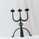 Black hand-forged iron candleholder statue with mid-century, 70s Brutalist tripod design