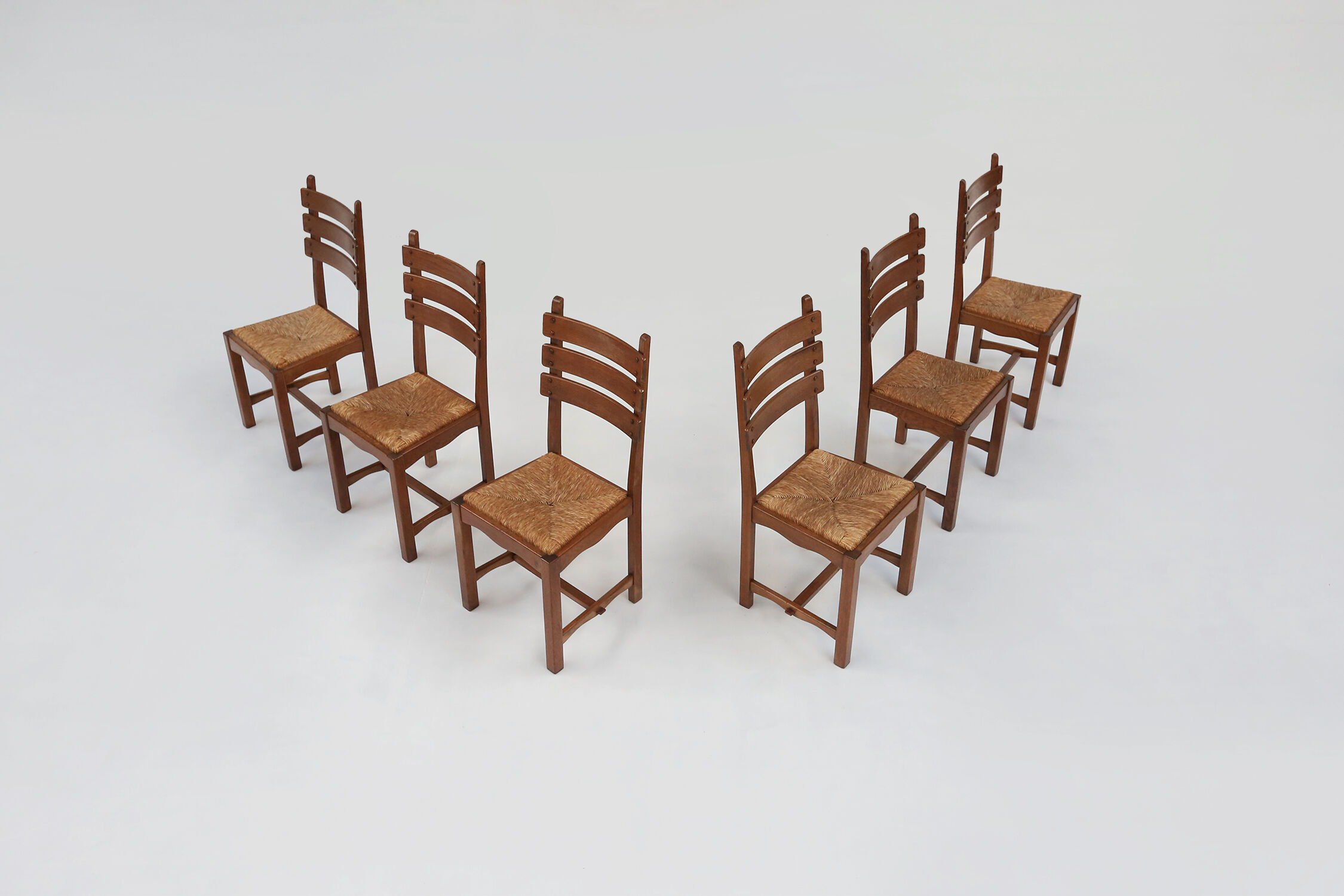 Set of six brutalist dining chairs in oak an wicker