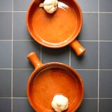 Two enameled terracotta fondue pots