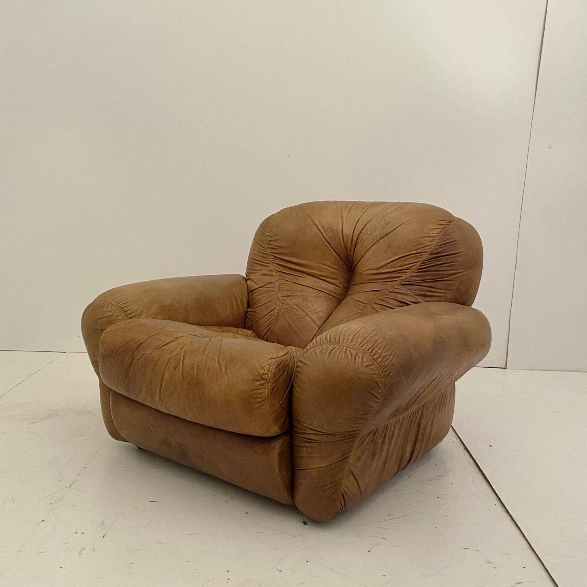 Pair of brown leather armchairs