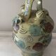 Mediterranean ceramic jug with floral decoration.
