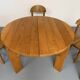 Extendable round table Maison Regain in solid elm, 1970s design.