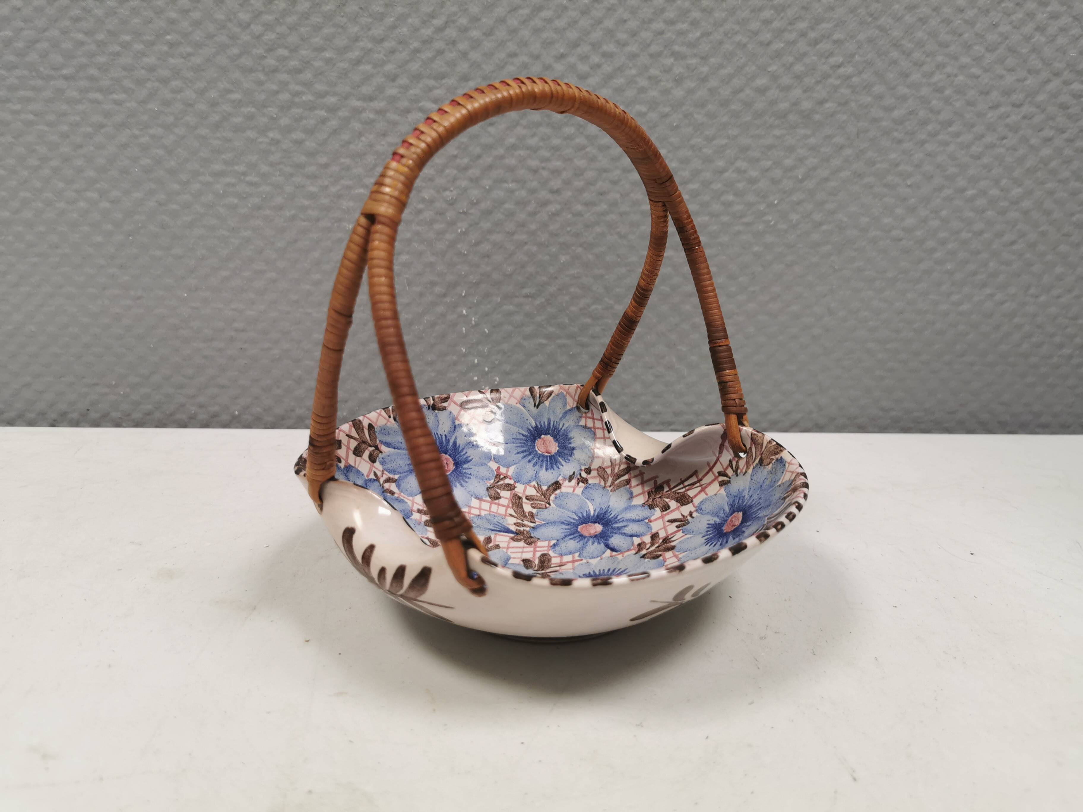 Beautiful small painted ceramic basket with woven handle
