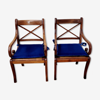 Two wooden armchairs with butts