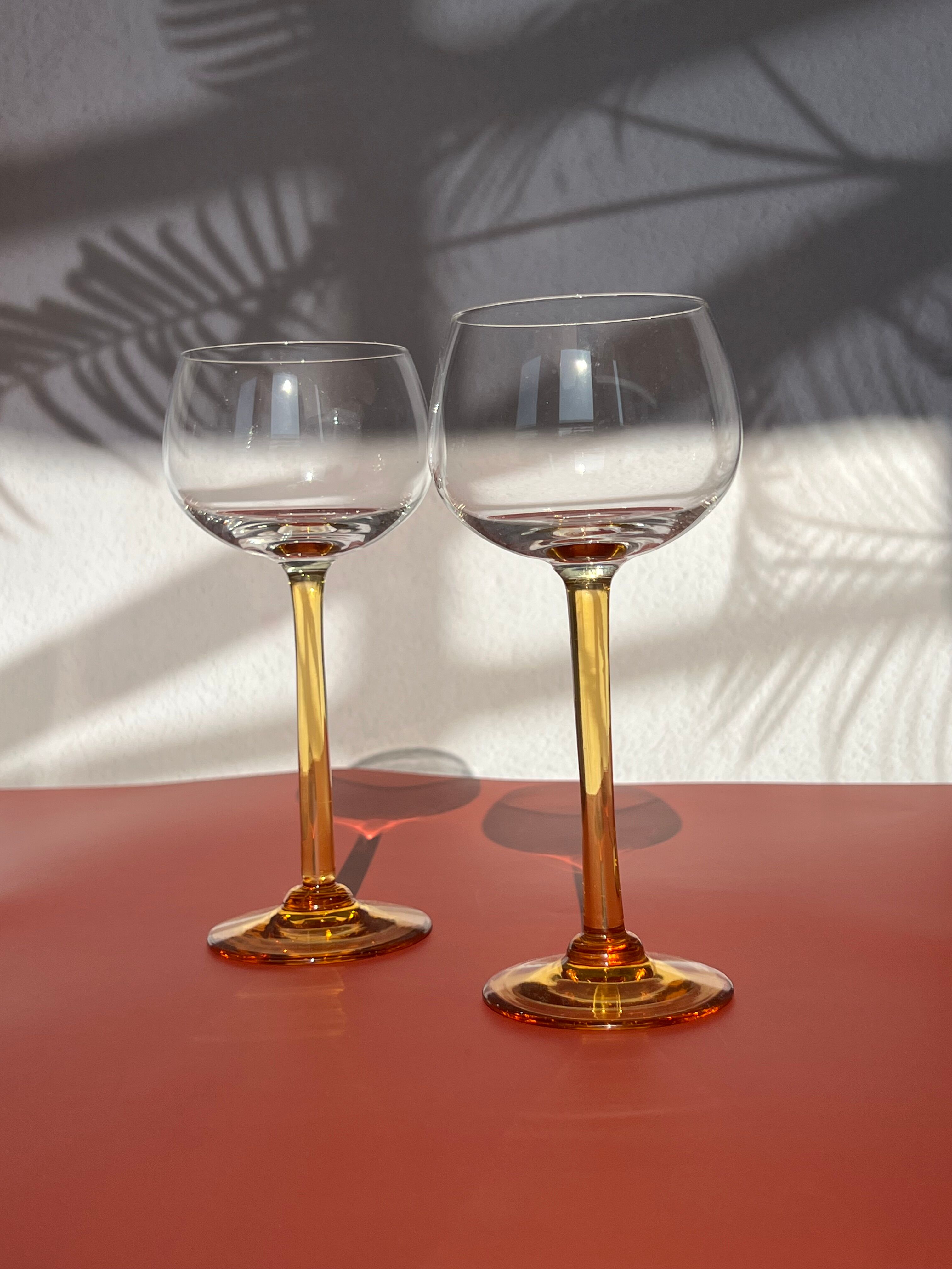 Pair of glass balloon vintage style Luminarc foot rod orange