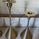 Set of three vintage brass candle holders