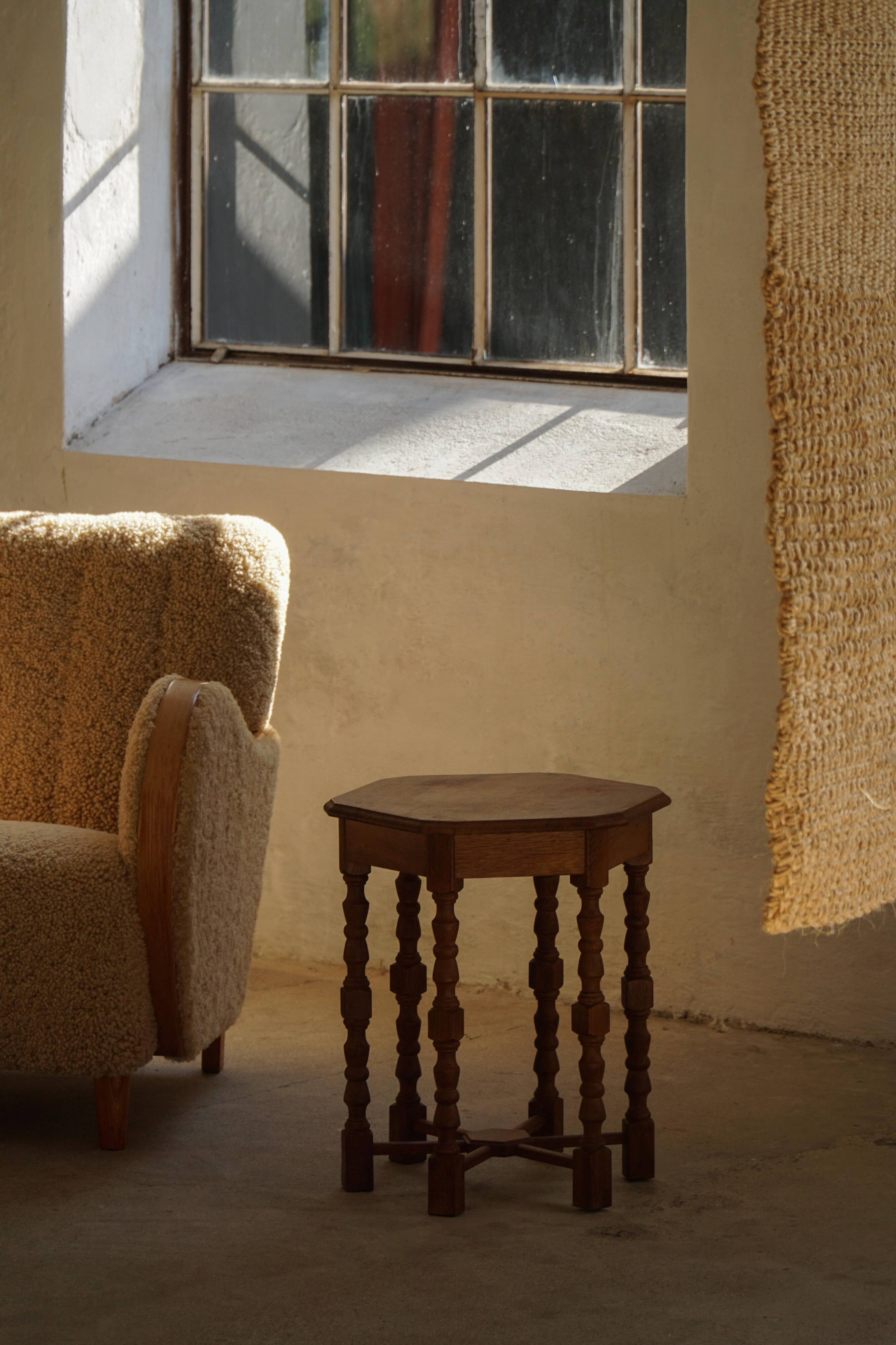 Danish hexagonal side table in oak with turned legs, 1950s.