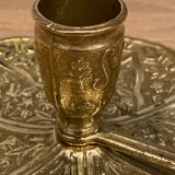 Brass candle holder on frame