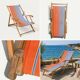 Vintage deck chair with orange and blue striped fabric, original patina.