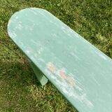 Old curved wooden farm bench