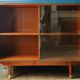 Enfilade wall vitrine in veneered teak from the 1960s.