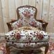Elegant Louis XV style bergère in cherry wood and floral velvet.