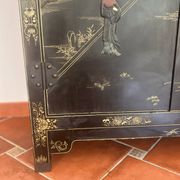 Magnificent black and gold lacquered Chinese cabinet.
