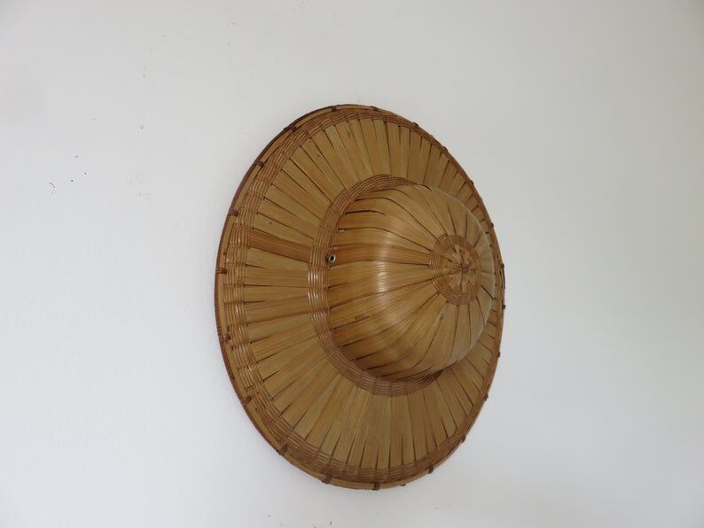 Colonial hat in bamboo and braided rattan, wall decoration