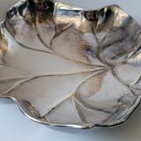 Old empty cut pocket in silver metal art nouveau in the shape of a sheet