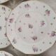 Lot de 12 assiettes à dessert en porcelaine Lourioux Foëcy France décor floral et doré