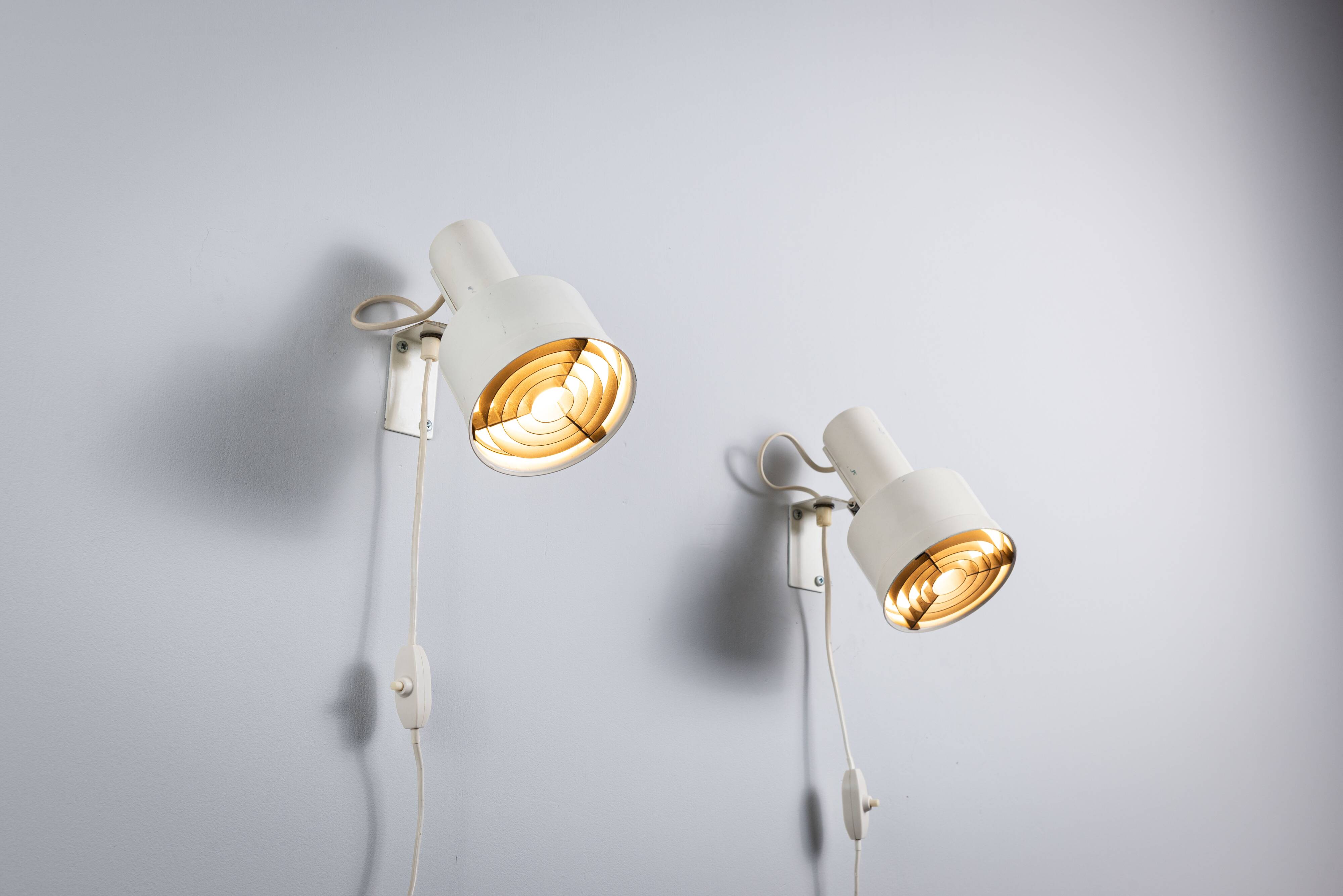Pair of adjustable wall lamps designed by Per Sundstedt for Kosta Lampan