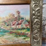 Pair of Art Deco wood and embossed metal landscape frames