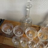 Engraved crystal service including 12 glasses and 2 carafes