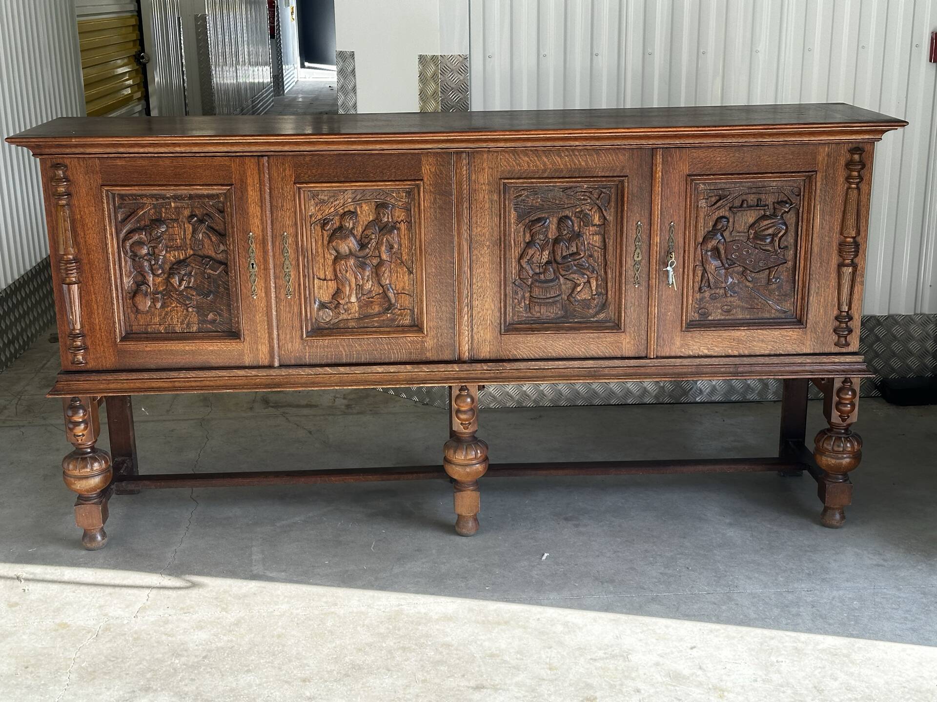Large carved oak buffet in neo-Renaissance style, mid-20th century.