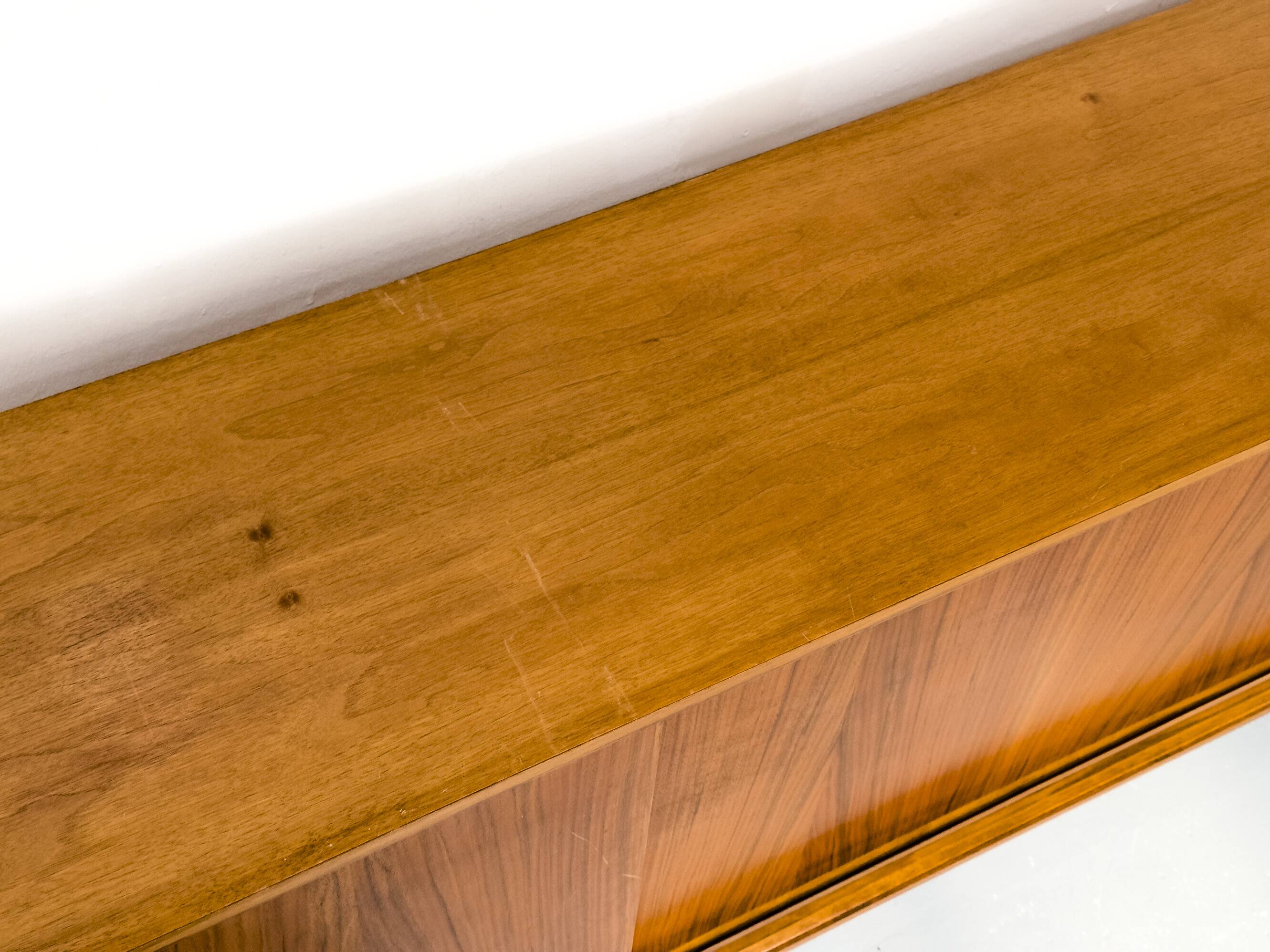 Walnut sideboard with sliding doors by Franzmeyer, 1959