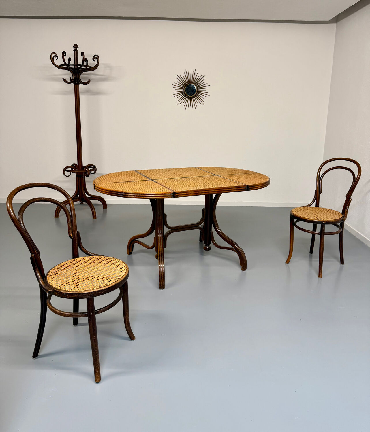 Vintage dining table with a cane top by Mundus from the 1970s.