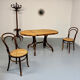 Vintage dining table with a cane top by Mundus from the 1970s.