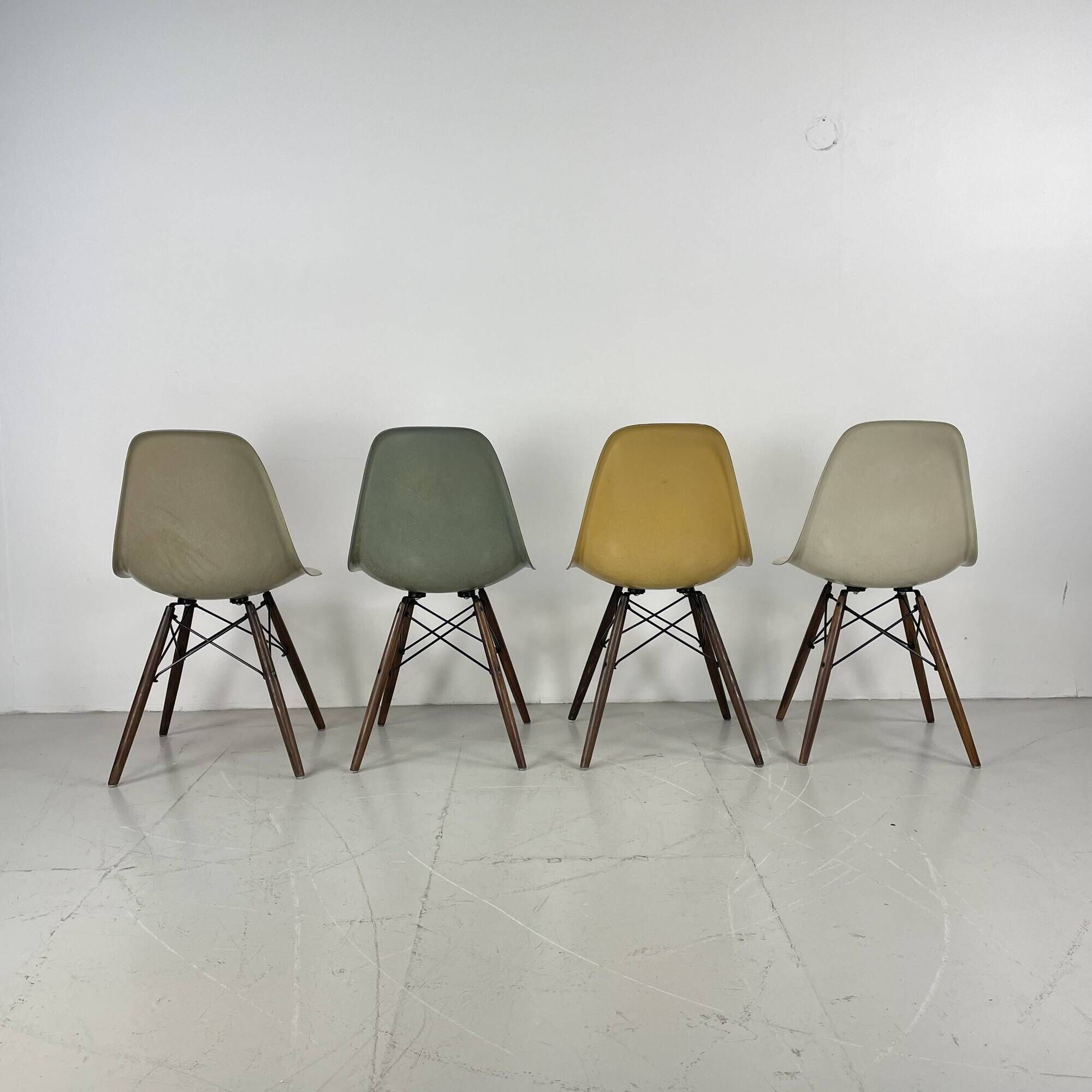 Eames Herman Miller DSW side chairs in greige, seafoam green, light ochre and parchment with slight