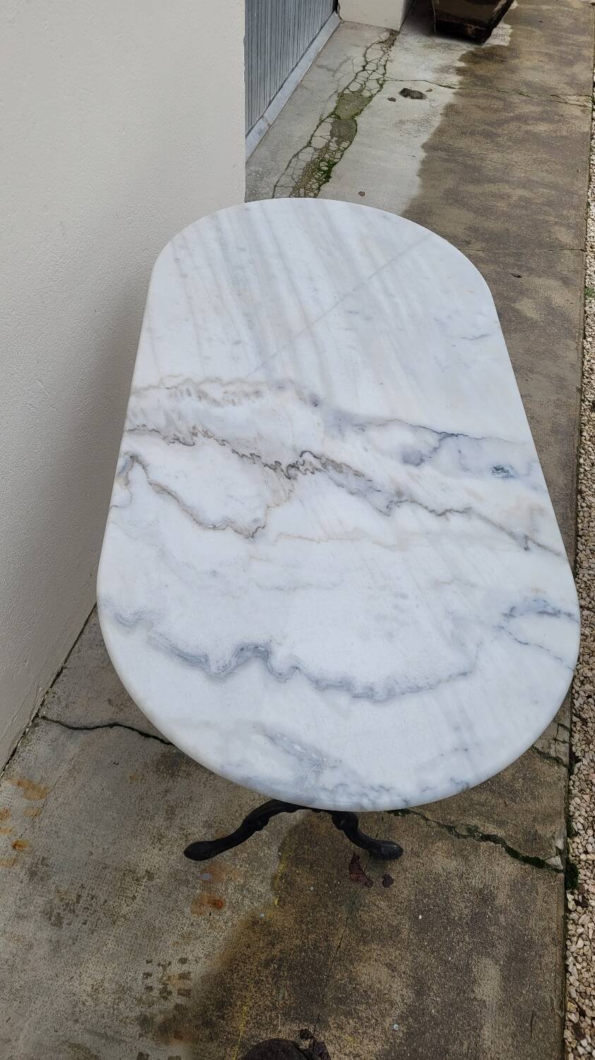 Antique cast iron bistro table with oval marble top