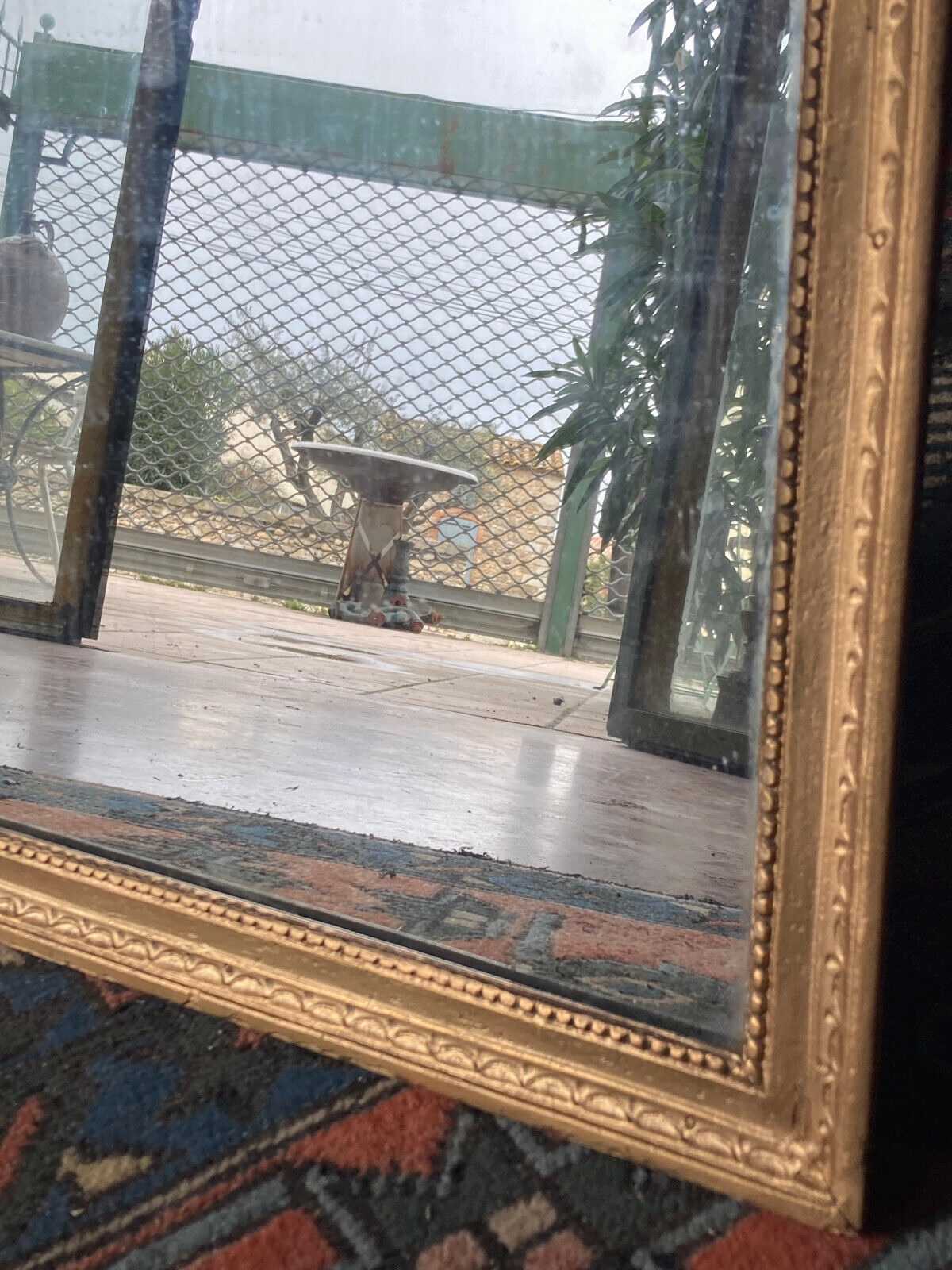 Old rectangular golden mirror baguette with beaded row