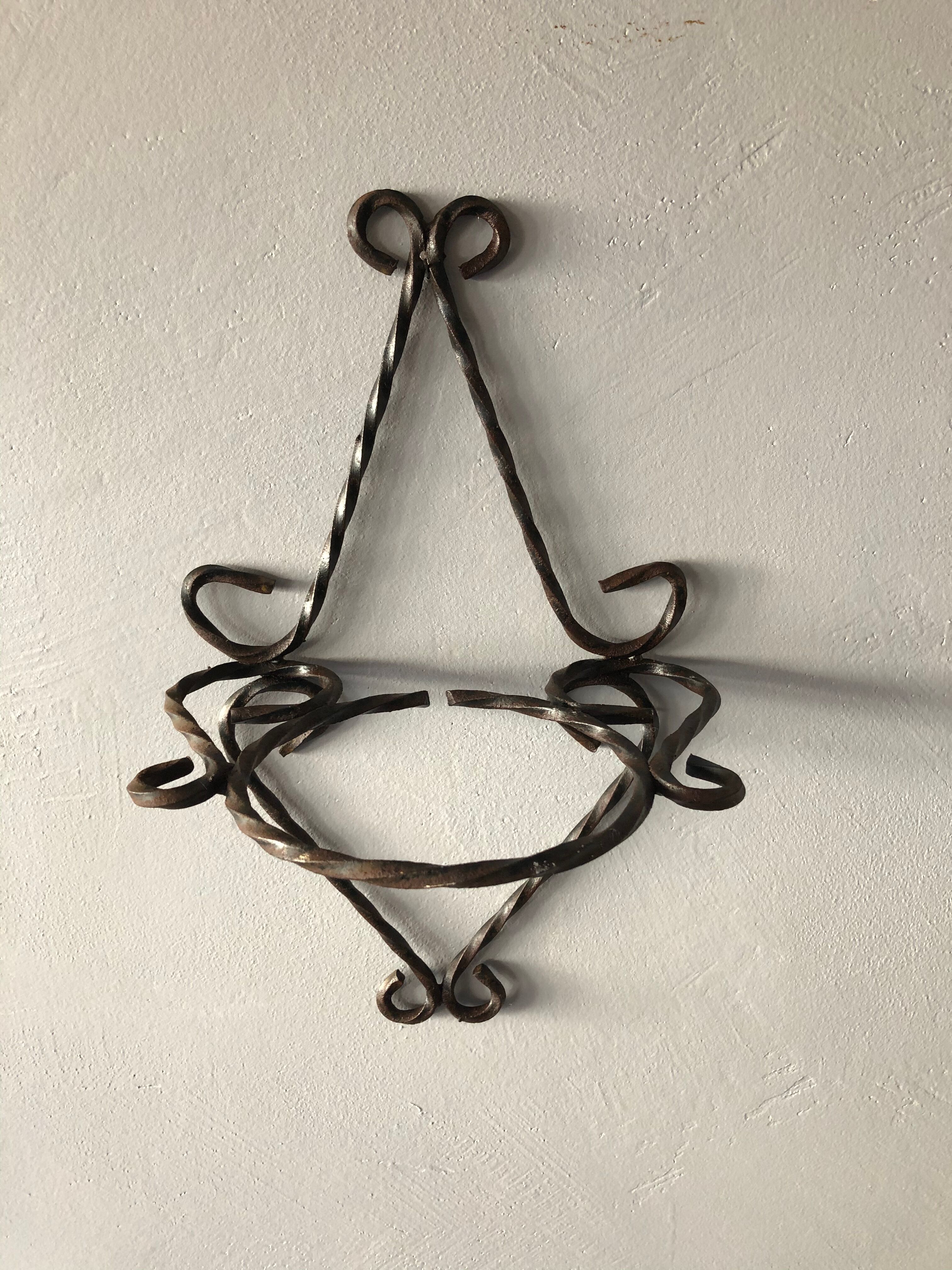 Wrought iron wall plant holder