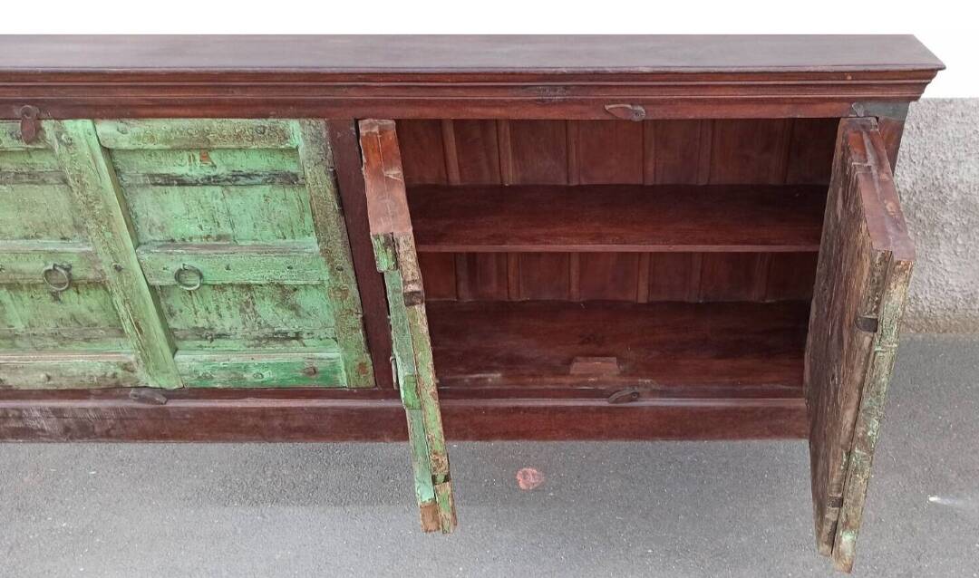 Long wooden sideboard with old green doors