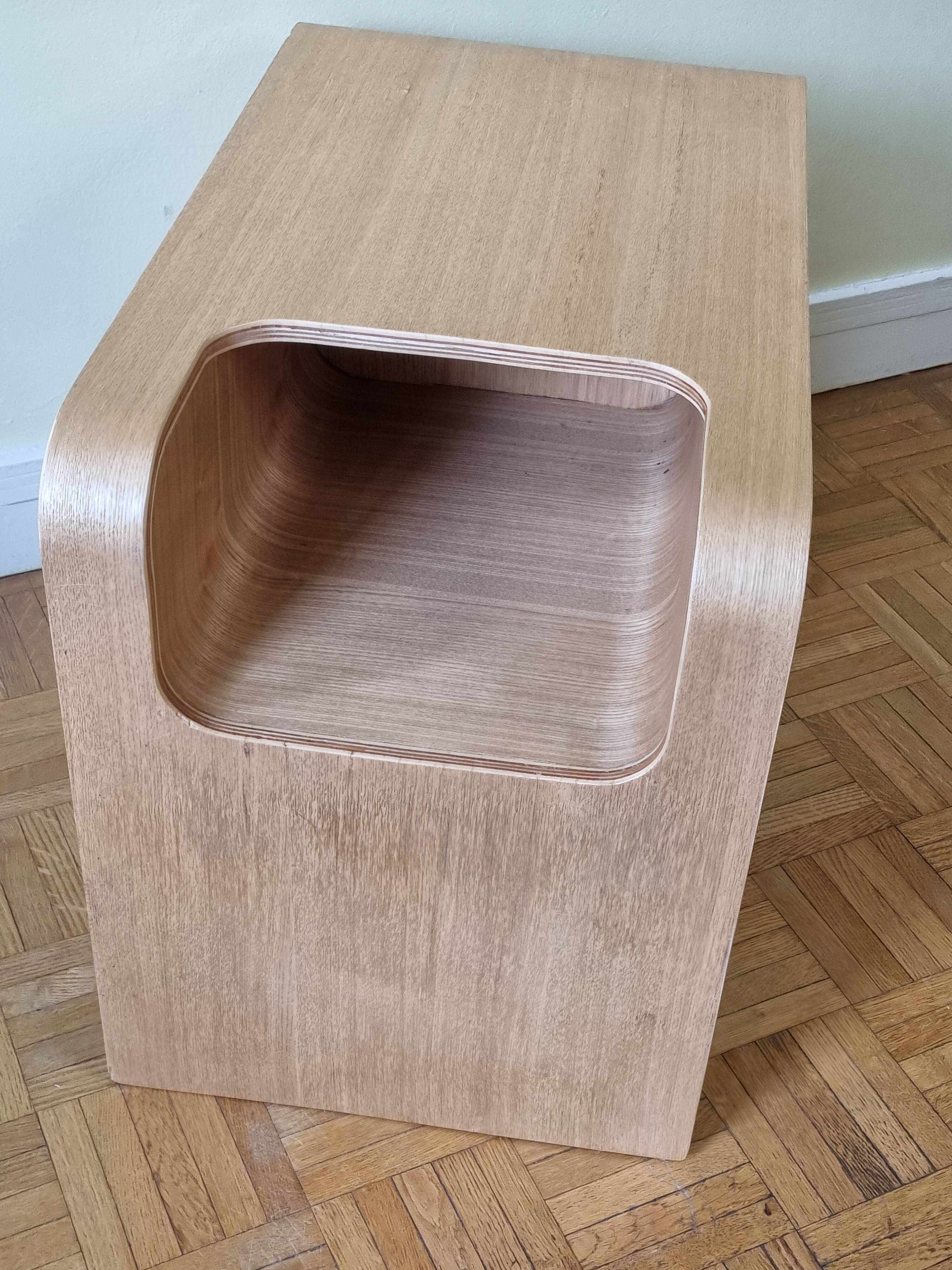 Boone coffee table in curved wood produced by Habitat, design