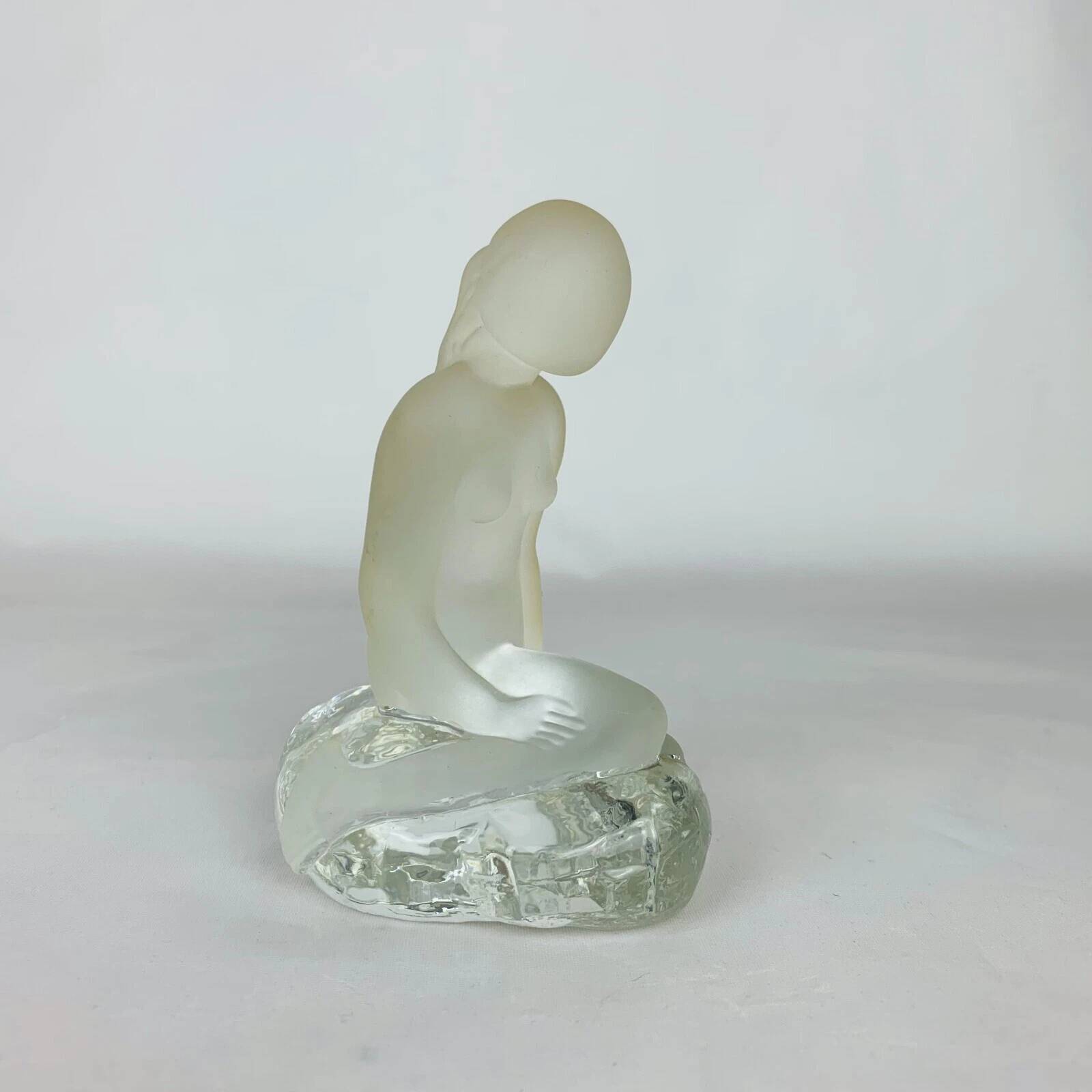 Vintage moulded glass mermaid sculpture.
