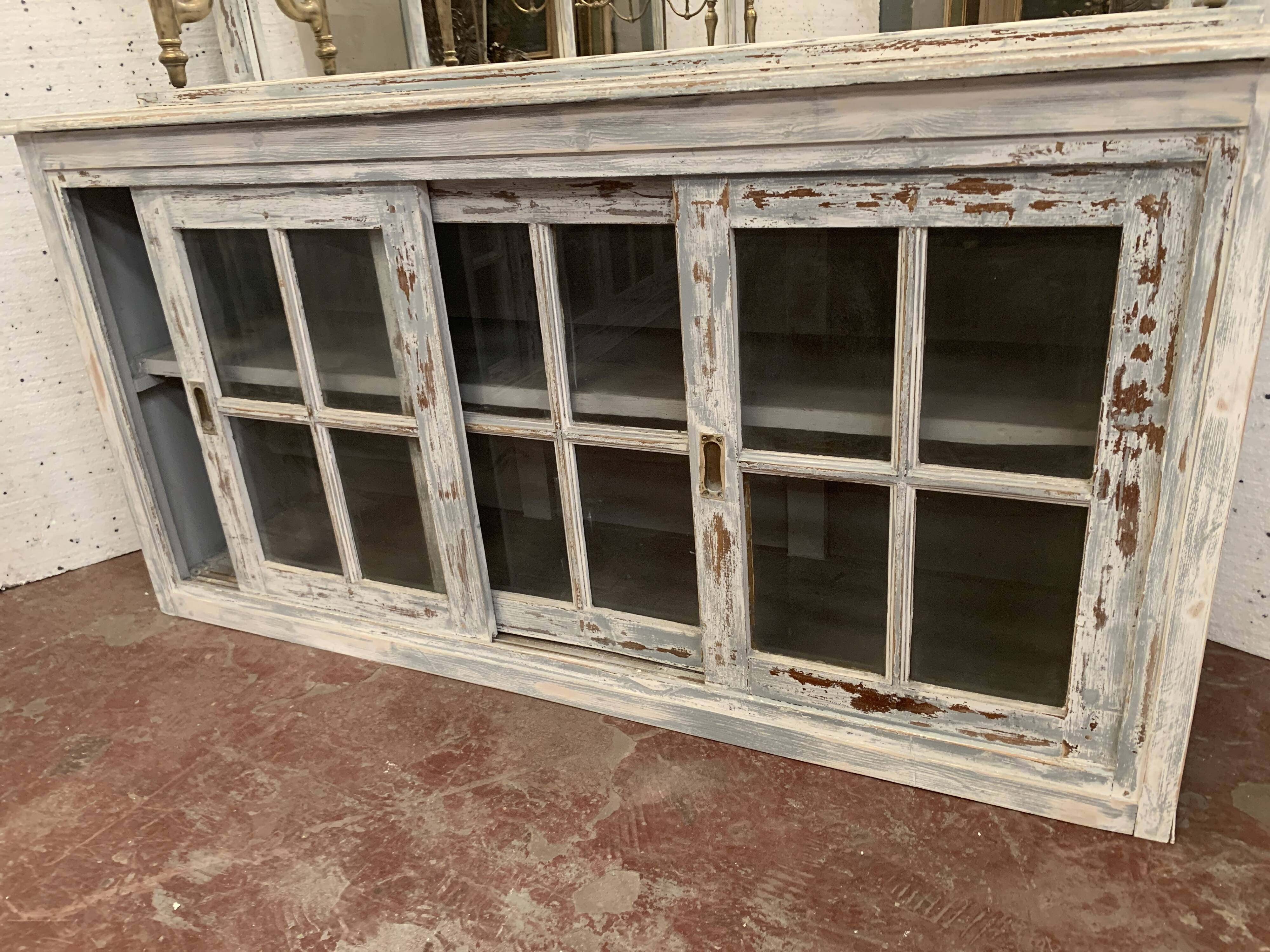 Store counter with sliding door patinated wood XX century