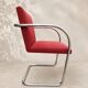 Vintage cantilever chair in chrome and burgundy fabric.
