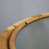1960s Italian rattan coffee table with glass top, mid-century round design