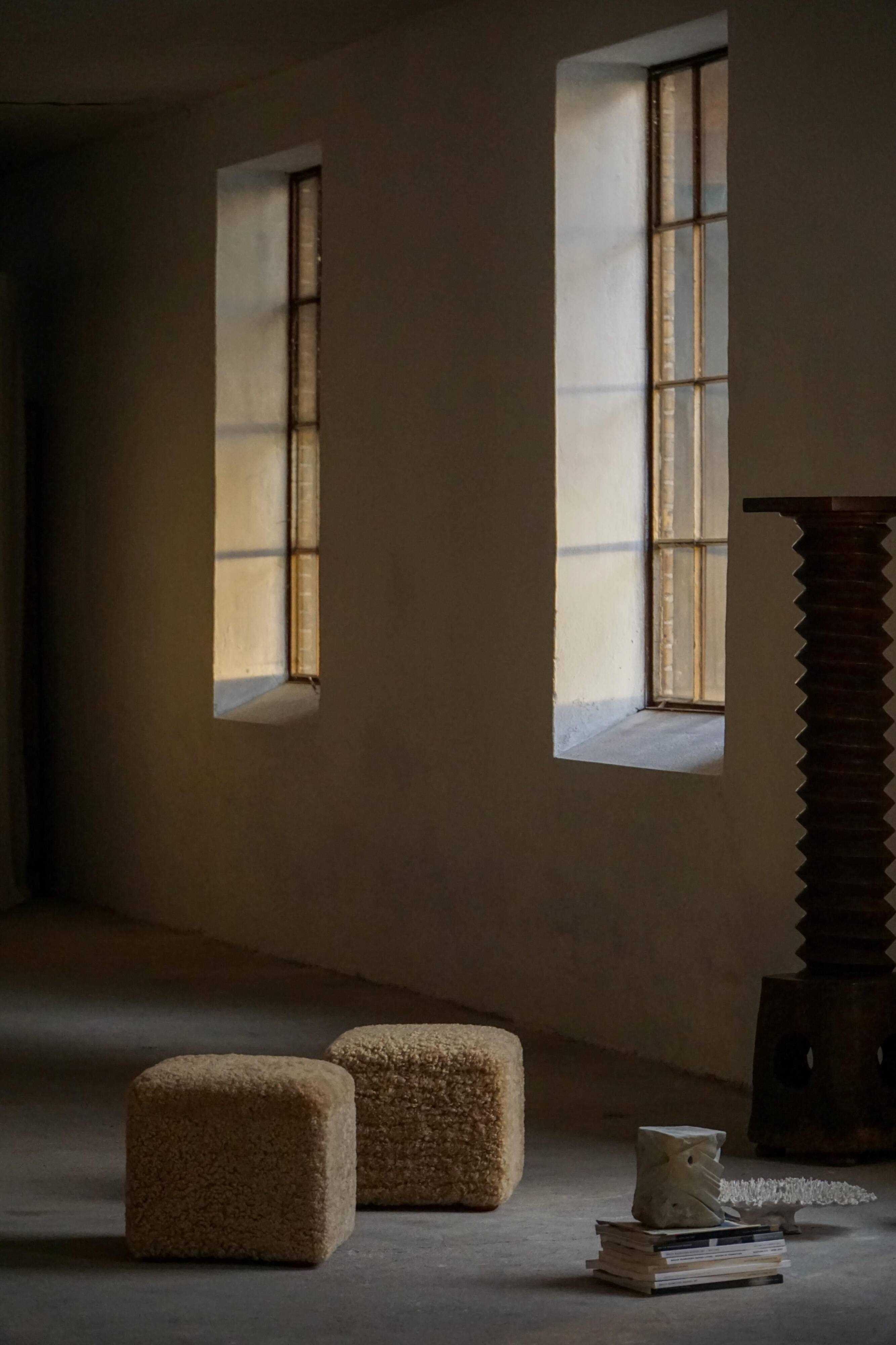 French mid-century cube poufs, a pair of lambswool stools, 1960s.