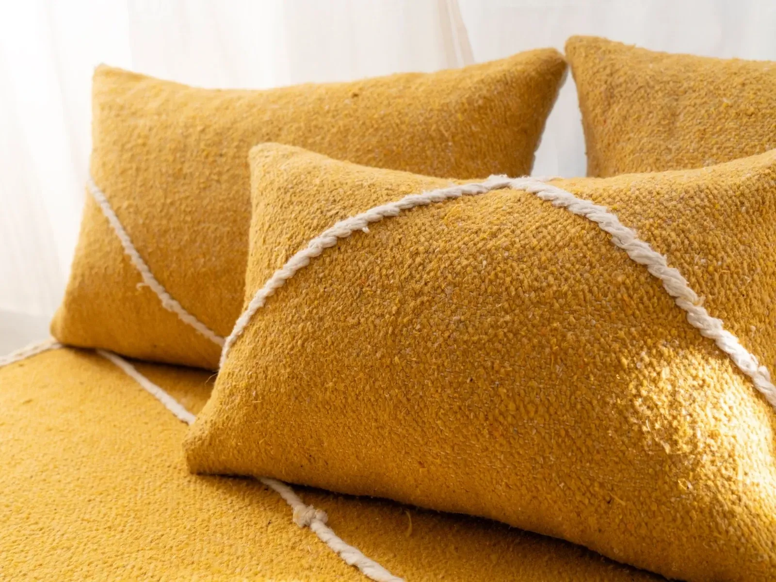 Set of yellow Moroccan floor sofa covers.