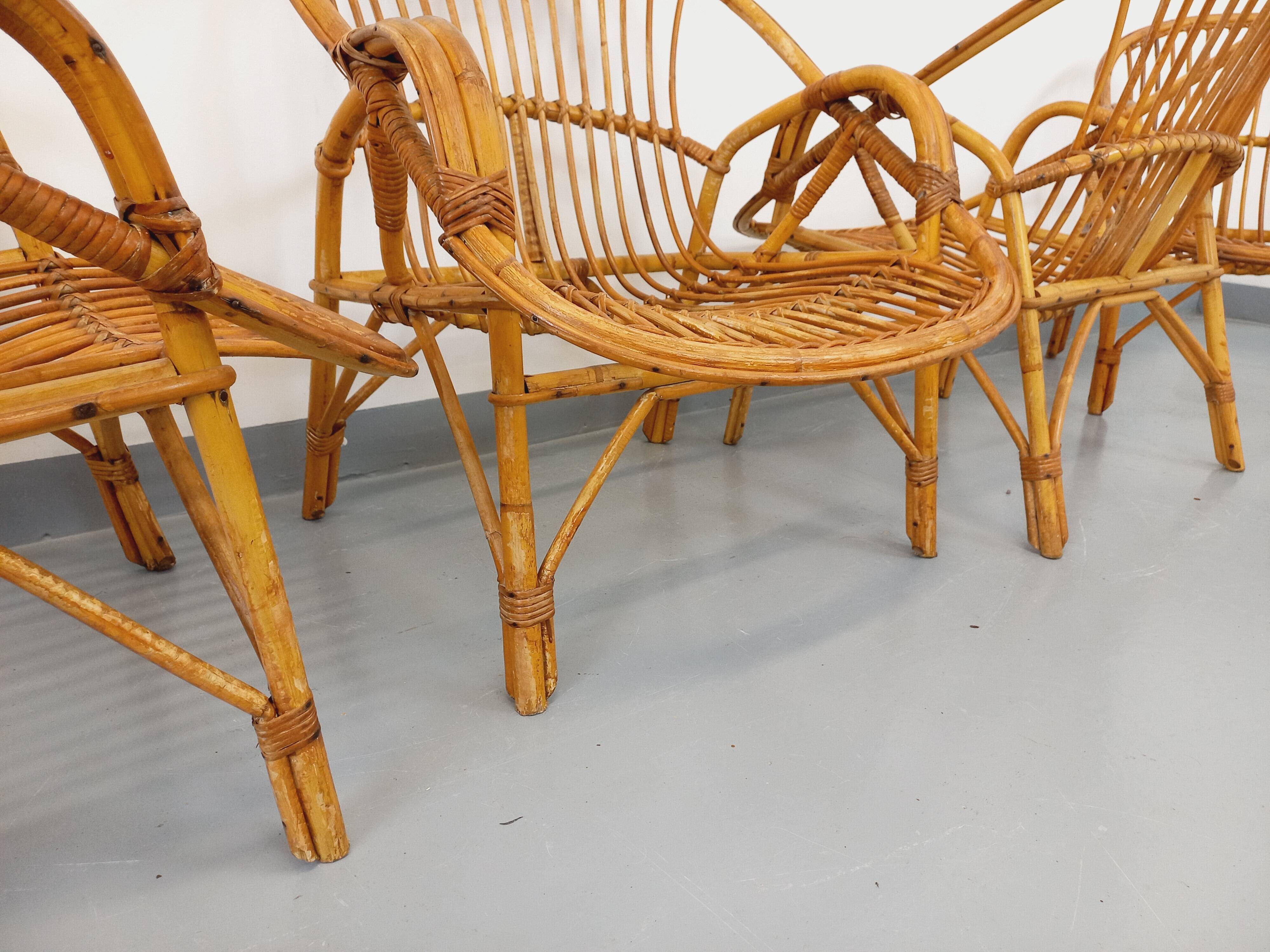 Set of 4 vintage rattan armchairs from the 60s