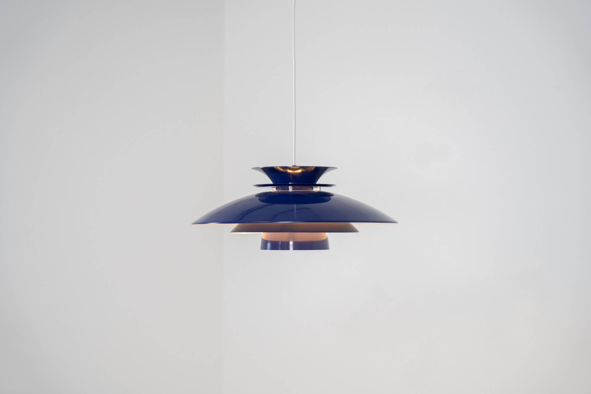 Elegant blue pendant light by Belux