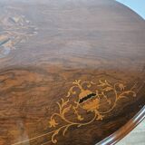 Coffee table in walnut with maple inlays and wheels