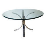 Round glass dining table, circa 1970.