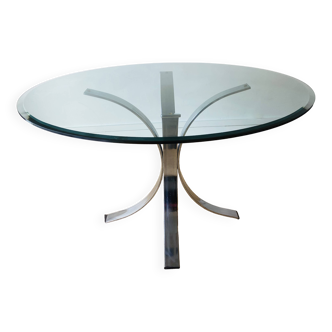 Round glass dining table, circa 1970.