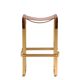 Contemporary kitchen stool, aged brass metal and cognac leather.