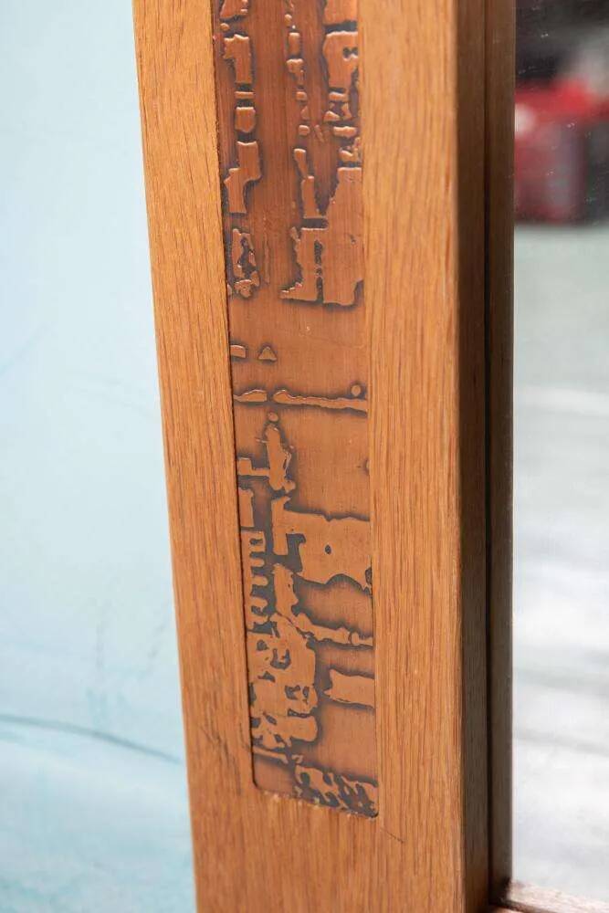 Vintage Danish wall mirror design from the 1960s in oak and stamped brass.