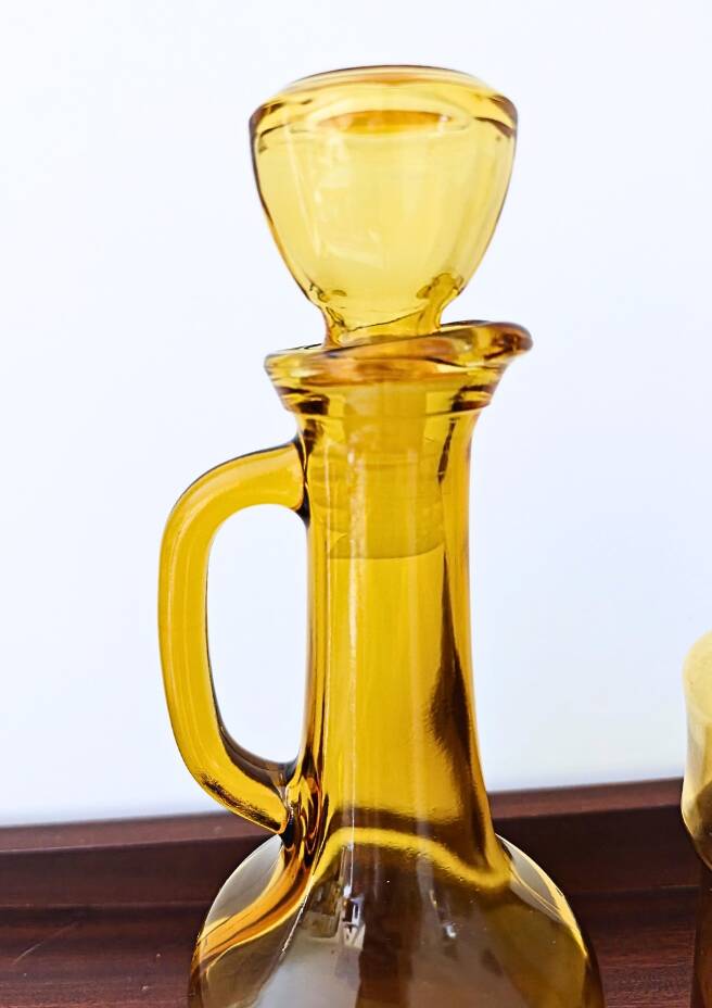 Set of two vintage amber glass carafes attributed to Lubiana.