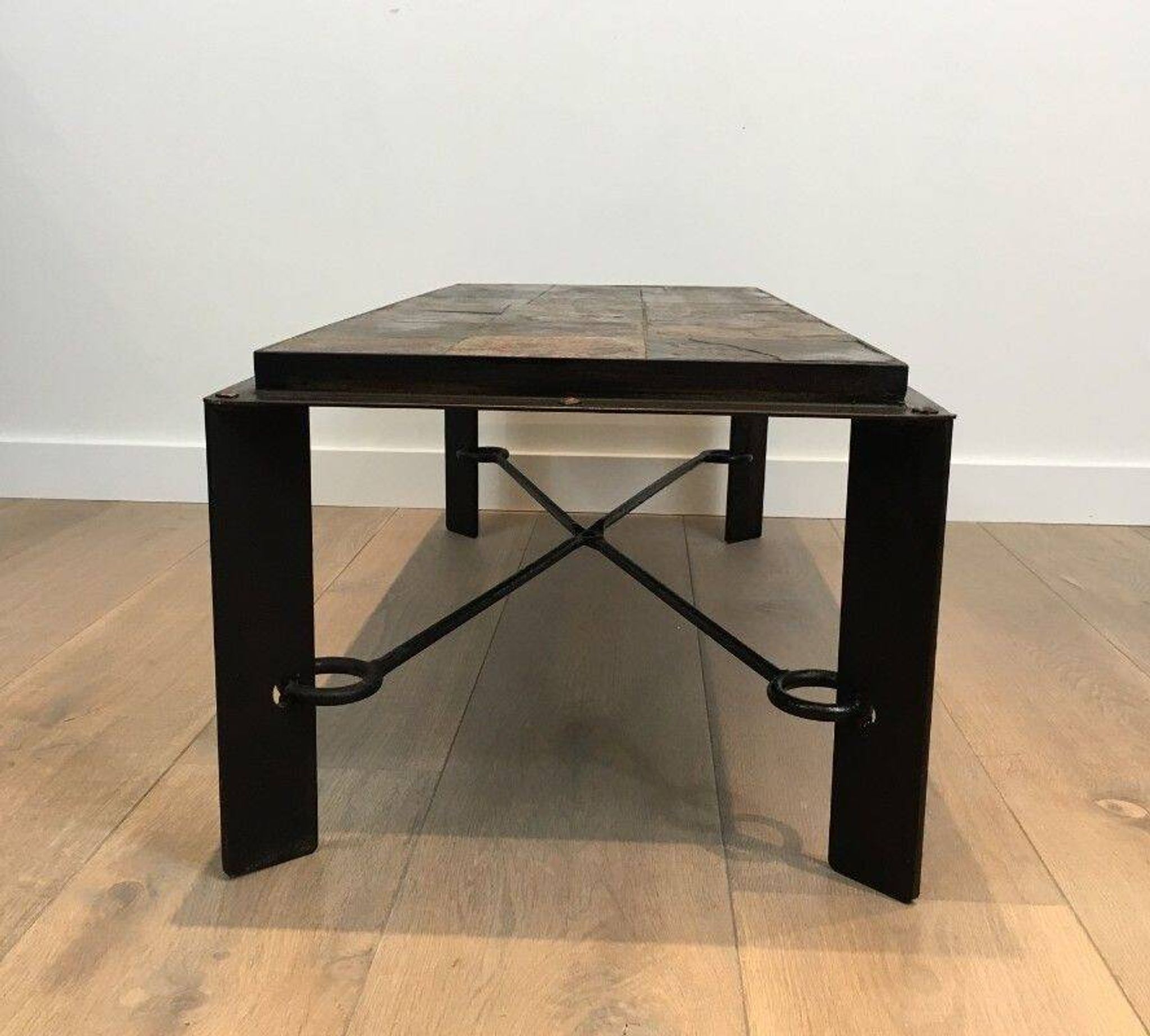 Rare coffee table in steel and wrought iron with a top made of lava stones