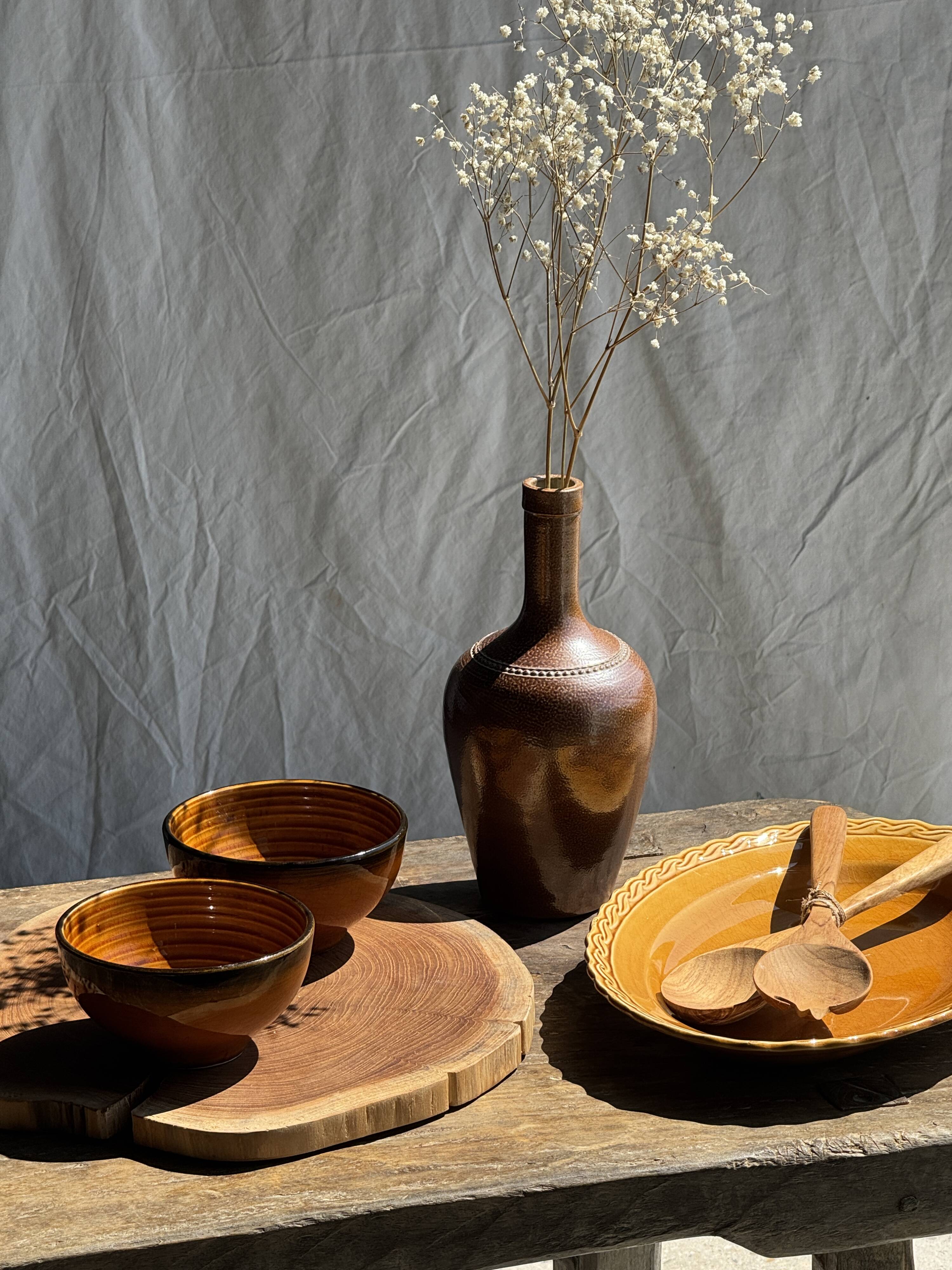 Pair of small orange bowls with black edging